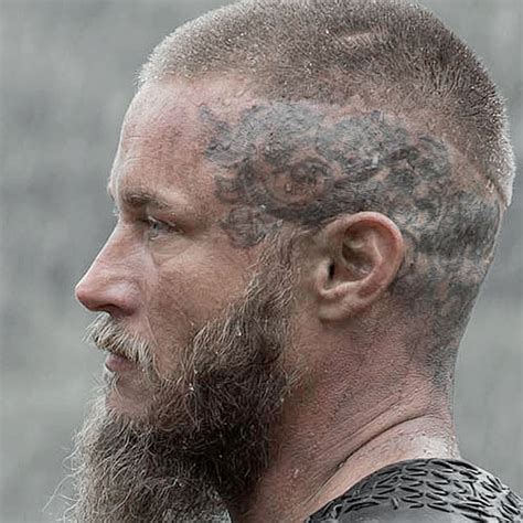 The beard is cropped really short and connected thin mustache which nicely complements the shaved head. Ragnar Lothbrok Hairstyle | Men's Hairstyles + Haircuts 2017