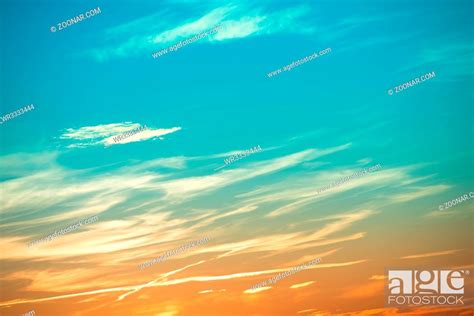 Sunset In The Sky With Blue Green And Orange Clouds And Big Sun Stock