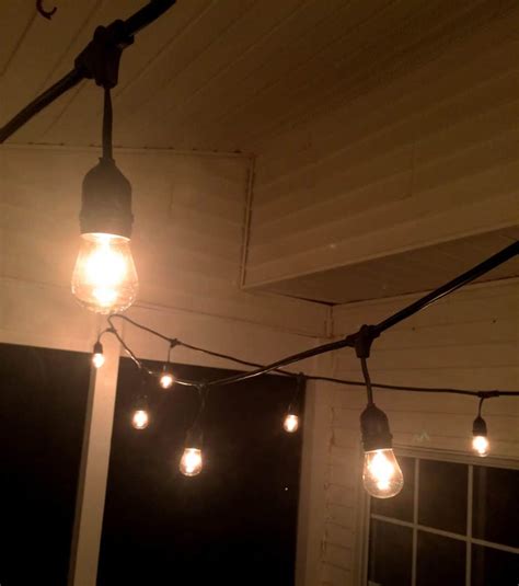 Hanging luckily it reached the floor. The Easiest Way to Hang String Lights on a Screened Porch