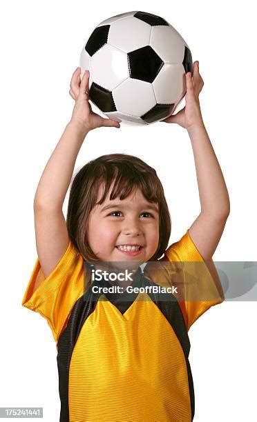 Child Holding Soccer Ball Above Her Head Stock Photo Download Image