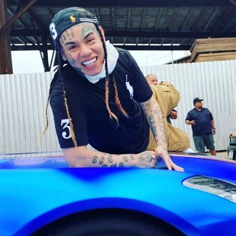 Tekashi 6ix9ine Rides On The Hood Of A Moving Vehicle During First Day