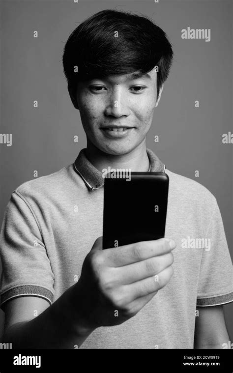 Asian Male Teen Phone Hi Res Stock Photography And Images Alamy
