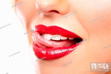 Cropped Closeup Of A Woman Wearing Red Lipstick And Licking Her Lip