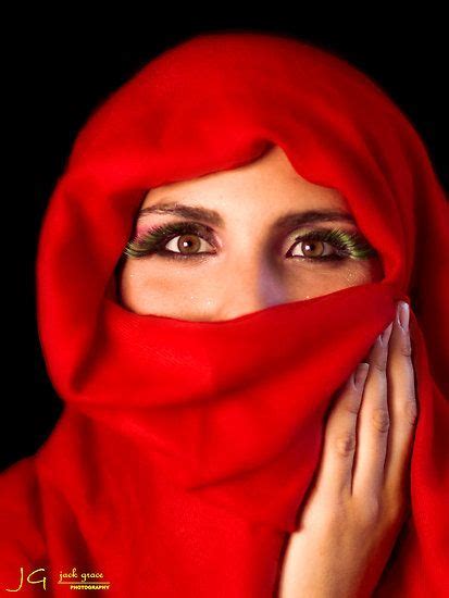 Portrait Of Beautiful Arabian Girl Hiding Her Face Behind Red Niqab A14