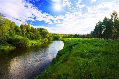 Alternatively, if he swims directly towards the camp, then he will swim on a bearing of 45º from the line directly across the river, giving a distance to swim of √2 mile, and @ 2 mph it will take him √2 / 2 = 0.707 hr. Green field near the river — Stock Photo © deltaoff #1604566