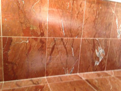 Excessive water buildup around the tub or shower area is one indication there may be water behind your tiles, which means there is likely damage. Repairing Damaged Marble Shower Tiles | Stone Cleaning and ...