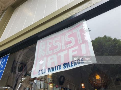 Close Up Shot Of A Sign Reading Resist Hate End White Silence