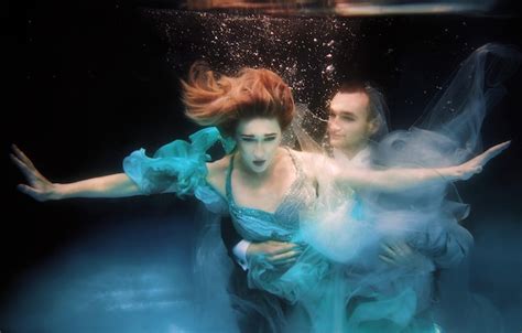 Premium Photo Beautiful Couple Dancing Underwater In The Swimming Pool