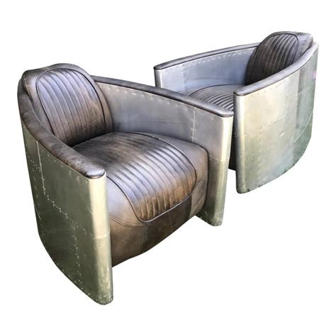 A low seat and raked back give it true flyboy swagger. Aviator Chairs by Restoration Hardware - A Pair | Chairish