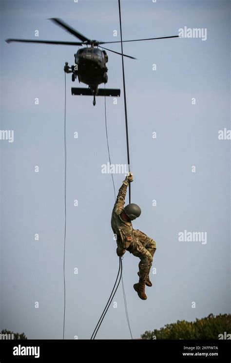 A Us Soldier Rappels From A Uh 60 Black Hawk Helicopter At Camp Dodge