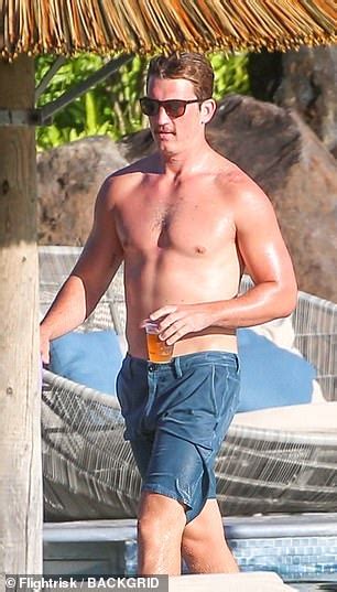 Miles Teller Flexes His Muscles On Romantic Holiday With Fiancee After