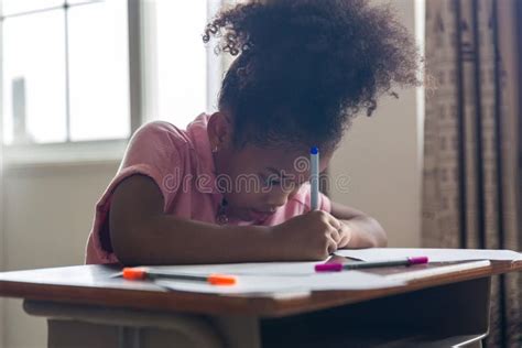 Girl Is Doing Homework In The Classroom Back To School Cute