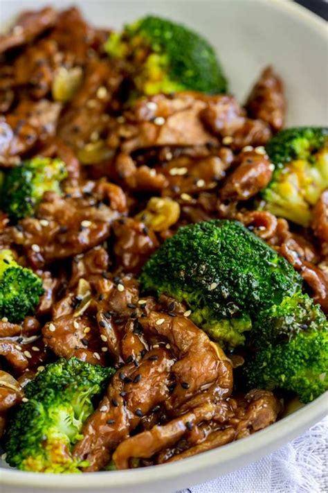 Tender beef and nutritious broccoli florets are coated with a tasty sauce. overhead showing the brown saucy beef and crisp broccoli | Easy beef and broccoli, Chinese beef ...