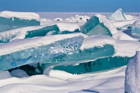 Shards Of Turquoise Ice Jut Out Of The Worlds Largest Lake