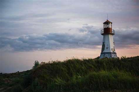Beautiful Lighthouse Standing On A Hill Above The Sea Stock Image