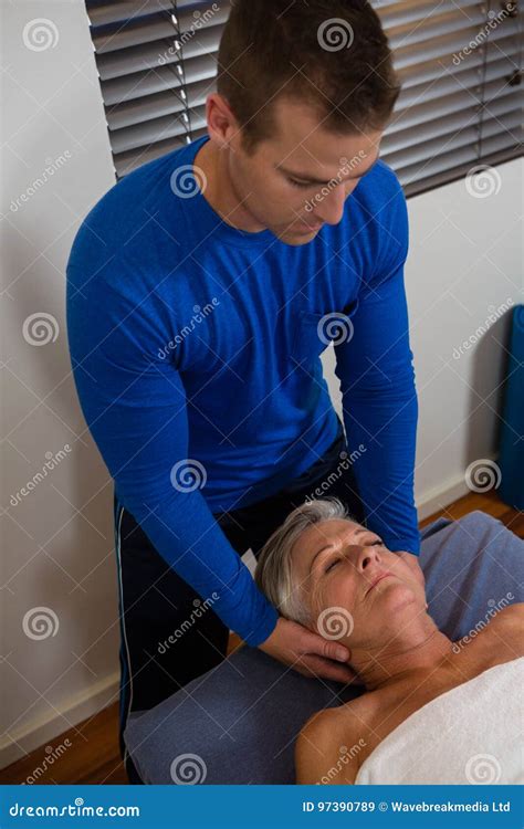 Senior Woman Receiving Massage From Physiotherapist Stock Image Image