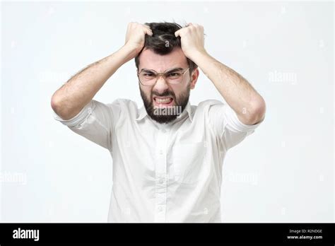 Angry Spanish Man Pulling Out His Hair Being Mad Looking With Furious