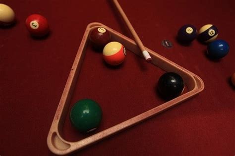 In terms of placement, the solitary ball at the top of the rack (the apex of the rack) should be sitting directly over the foot spot. How To Rack Pool Balls - Real Hard Games