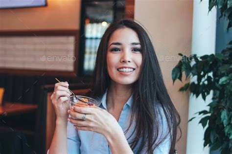 Beautiful Charming Brunette Smiling Asian Girl Has Healthy Breakfast