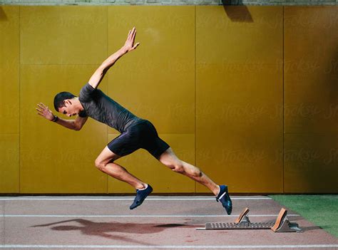 Man Sprinting In Gym By Stocksy Contributor Javier Díez Stocksy