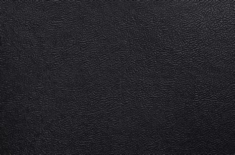 Close Up Of A Black Shiny Fake Leather Surface With A Coarse Texture