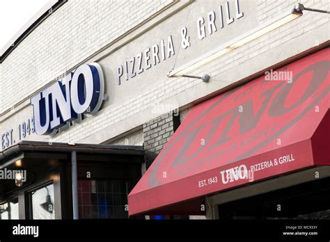 A Logo Sign Outside Of A Uno Pizzeria And Grill Restaurant Location In
