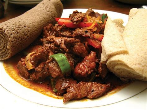 Special Tibs Marinated Beef With Injera In Ethiopian Beef Tibs Recipe Food Food Recipes