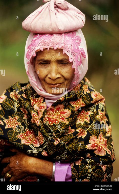 old lady carrying a bag on the top of her head sumatra island republic of indonesia southeast