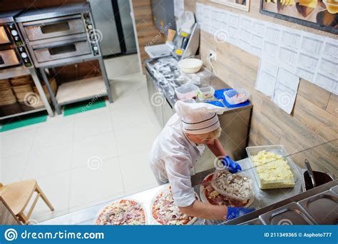 Female Chef Preparing Pizza In Restaurant Kitchen Stock Image Image