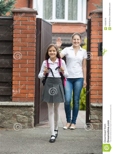 Teenage Girl In School Uniform Going To School From Home