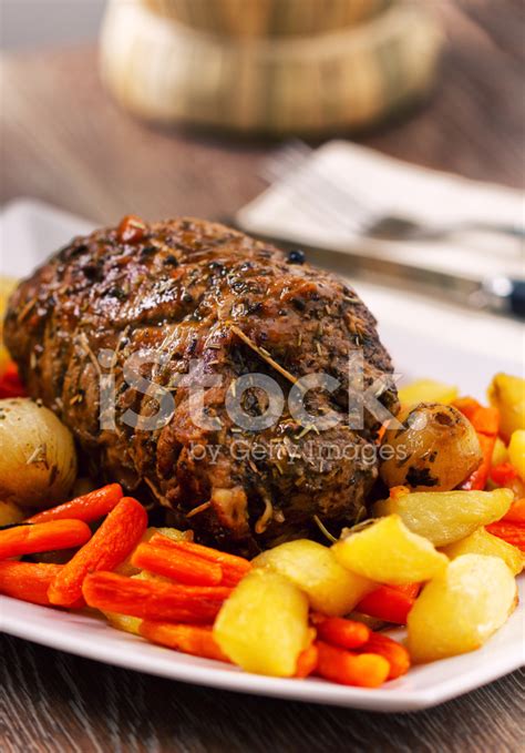 Potatoes and carrots cooked with the beef are a natural option as a side dish. Roast Beef With Potatoes and Carrots Stock Photos ...