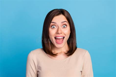 Photo Of Astonished Young Girl Toothy Smile Open Mouth Isolated On Blue