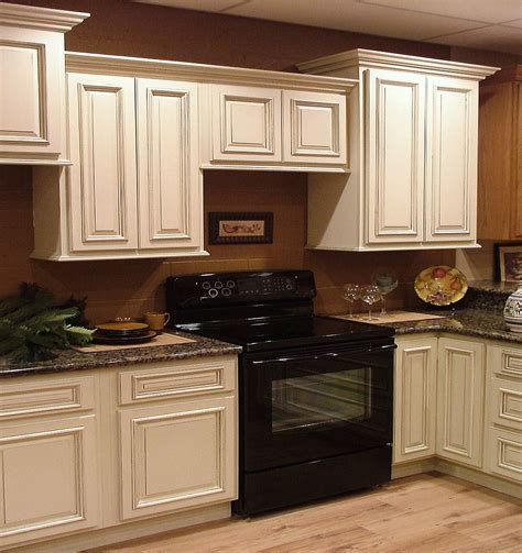 A Black Stove Top Oven Sitting Inside Of A Kitchen Next To White