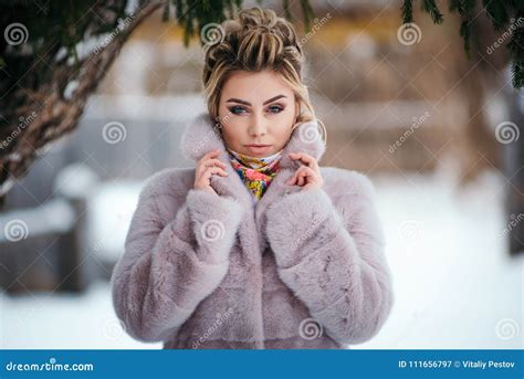 beautiful girl in fur coat in winter in the forest stock image image