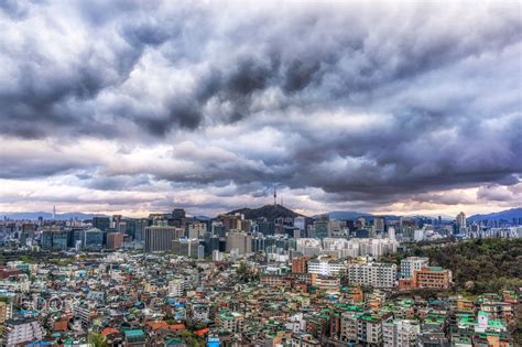 dark sky over Seoul - Stormy dark sky over Seoul on top of inwang mountain. The view looks over 