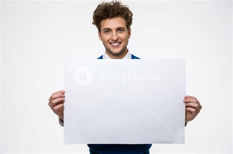 Happy Man Holding Empty Paper And Looking At Camera Royalty Free Stock Image Storyblocks
