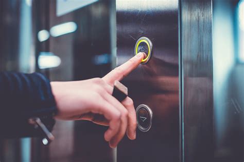 Hand Pushing Elevator Button Stock Photo - Download Image Now - iStock