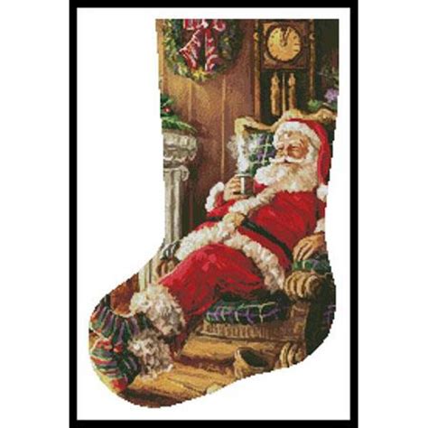 artecy cross stitch santa resting stocking left 13721 int cross stitch chart hard copy jk s