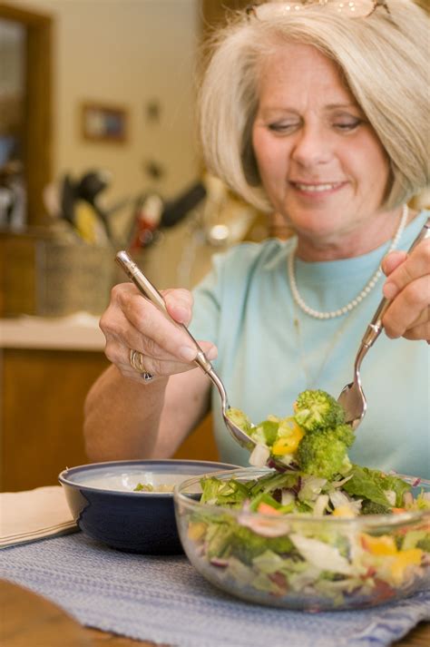 Salad Free Stock Photo A Woman Eating A Fresh Salad 17231