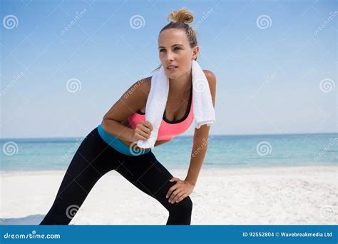 Woman Looking Away While Bending At Beach Stock Photo Image Of