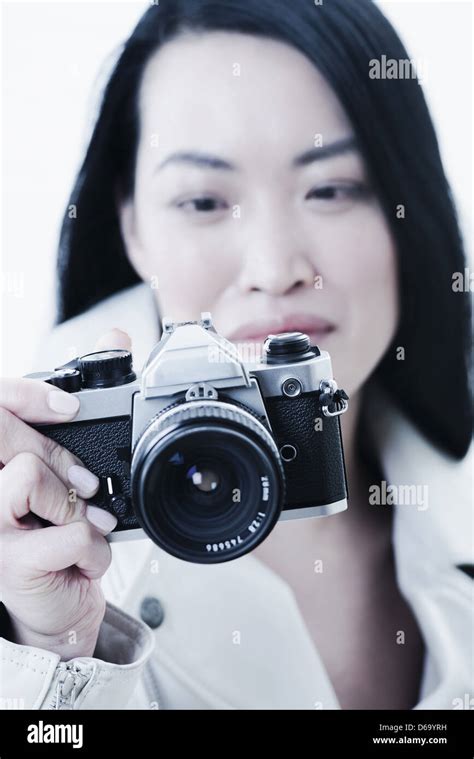 Woman Taking Pictures With Camera Stock Photo Alamy