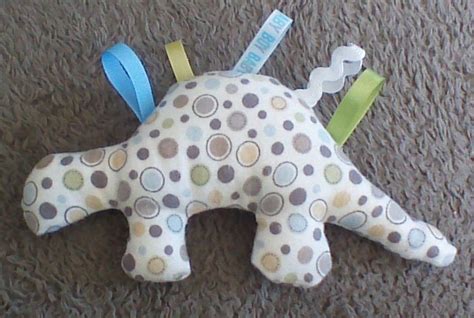 Dinosaur Baby Rattle Taggie Toy By Cuteasaknopf On Etsy
