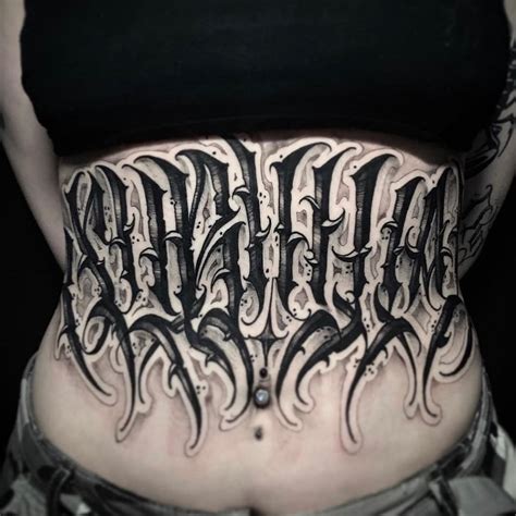 stomach lettering tattoos