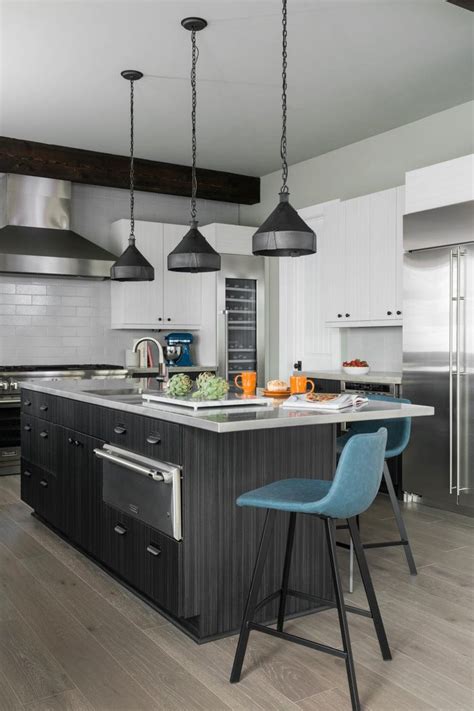 20 gray kitchen cabinets we're loving. 20 Gray Kitchens, HGTV || Black & gray woodgrain lower cabinets, industrial light shades ...