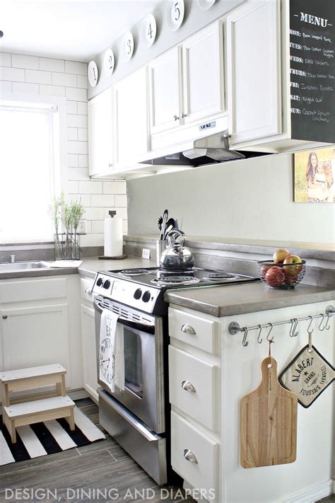 Keeping it simple with a fruit bowl, bright blue tea kettle, and small plant next to the sink completes the fresh farmhouse look. Modern Farmhouse Small Kitchen Remodel