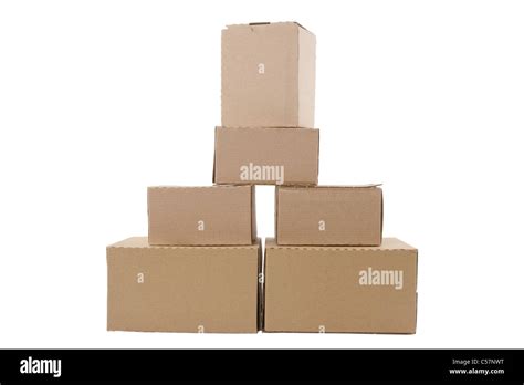 Brown Cardboard Boxes Arranged In Stack On White Background Stock Photo
