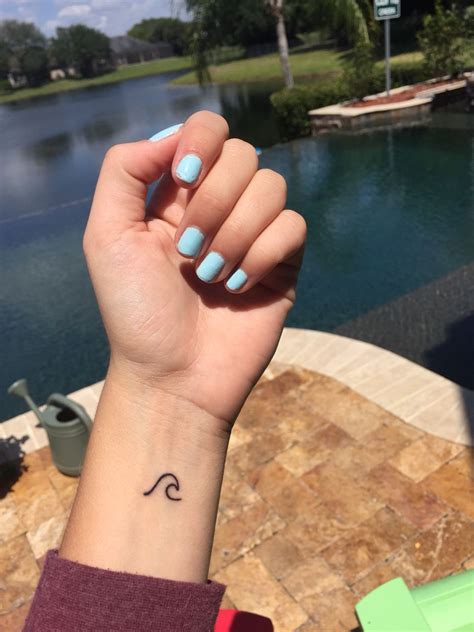 Want to see the world's best simple wave tattoo ideas? Small wave wrist tattoo
