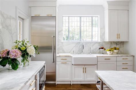 The standard depth of countertops is just over 25 inches, allowing about an inch of overhang in the front. Your Guide to White Kitchen Countertops | Tasting Table