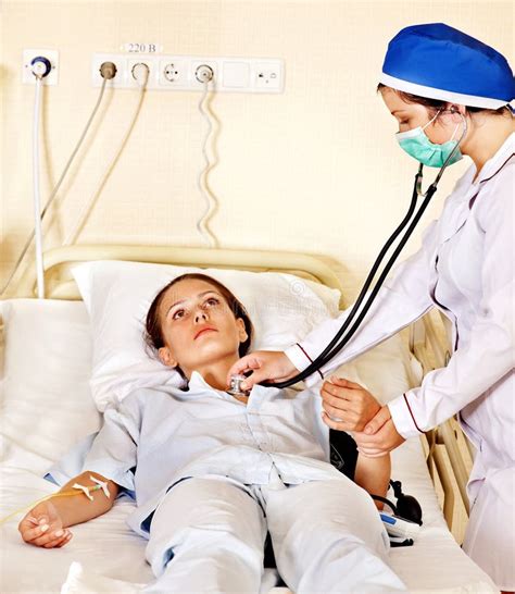 Doctor Treats Patient With Stethoscope Stock Photo Image Of