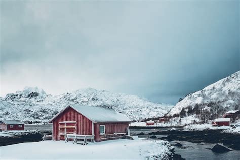 Premium Photo Traditional Red Rorbu House On Fjord Shore With Heavy